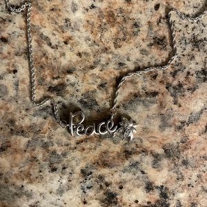 Kay Jewelers “Peace” necklace, with tiny diamonds